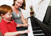 A young musician practicing at the piano